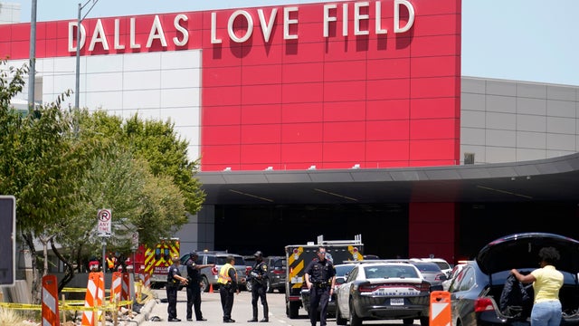 Emergency responders converge near the main entrance at Dallas Love Field airport in Dallas, July 25, 2022. 