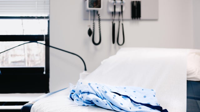 Medical Gown on Examination Table in Doctor's Office 